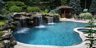 Custom designed pool with rock waterfall feature.