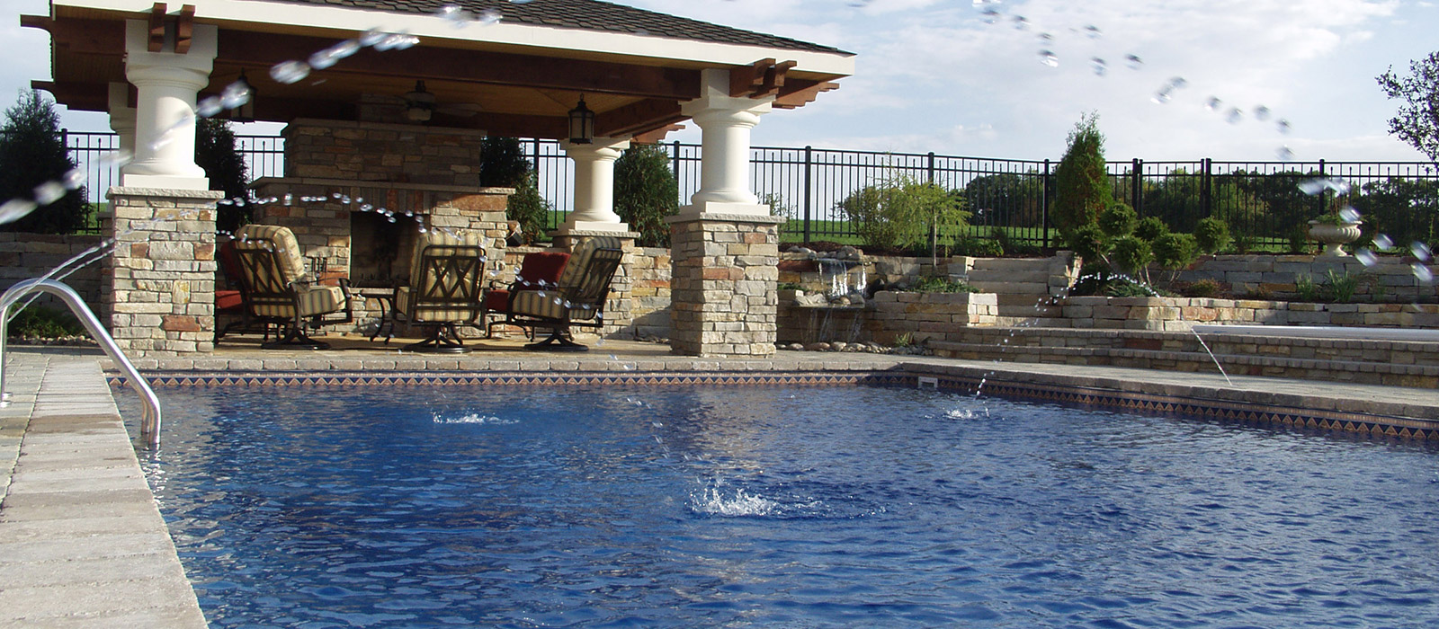 Custom designed swimming pool with lanai and outdoor fireplace