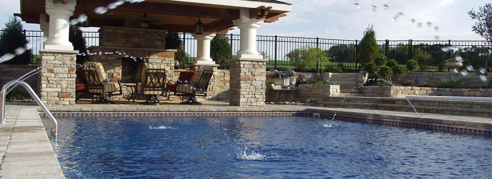 Custom designed swimming pool with lanai and outdoor fireplace