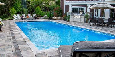 Backyard Pool With Laminar Jets, Paver Pool Deck & Built-In Fire Pit.